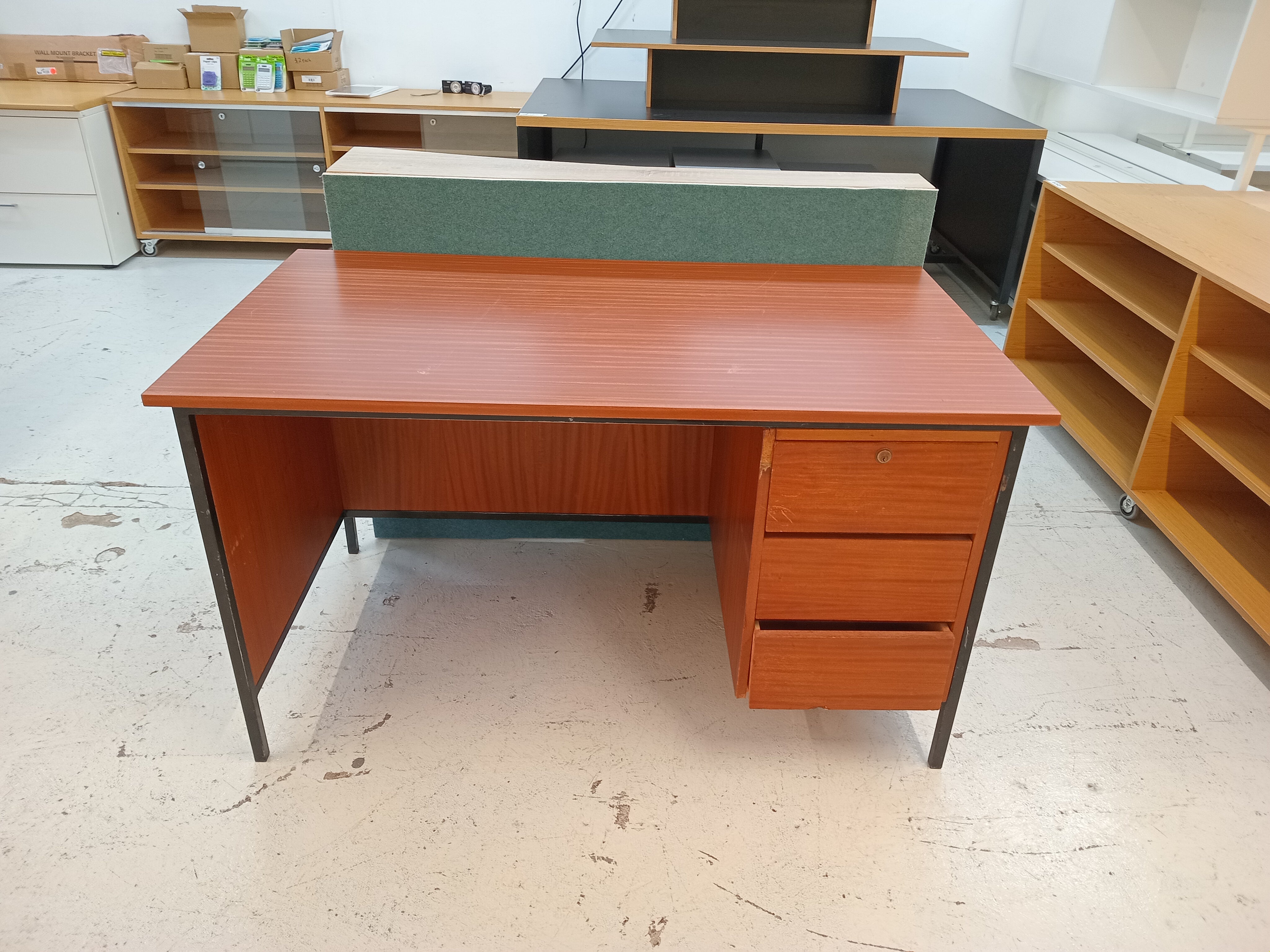 Brown, wood-like desk with drawers
