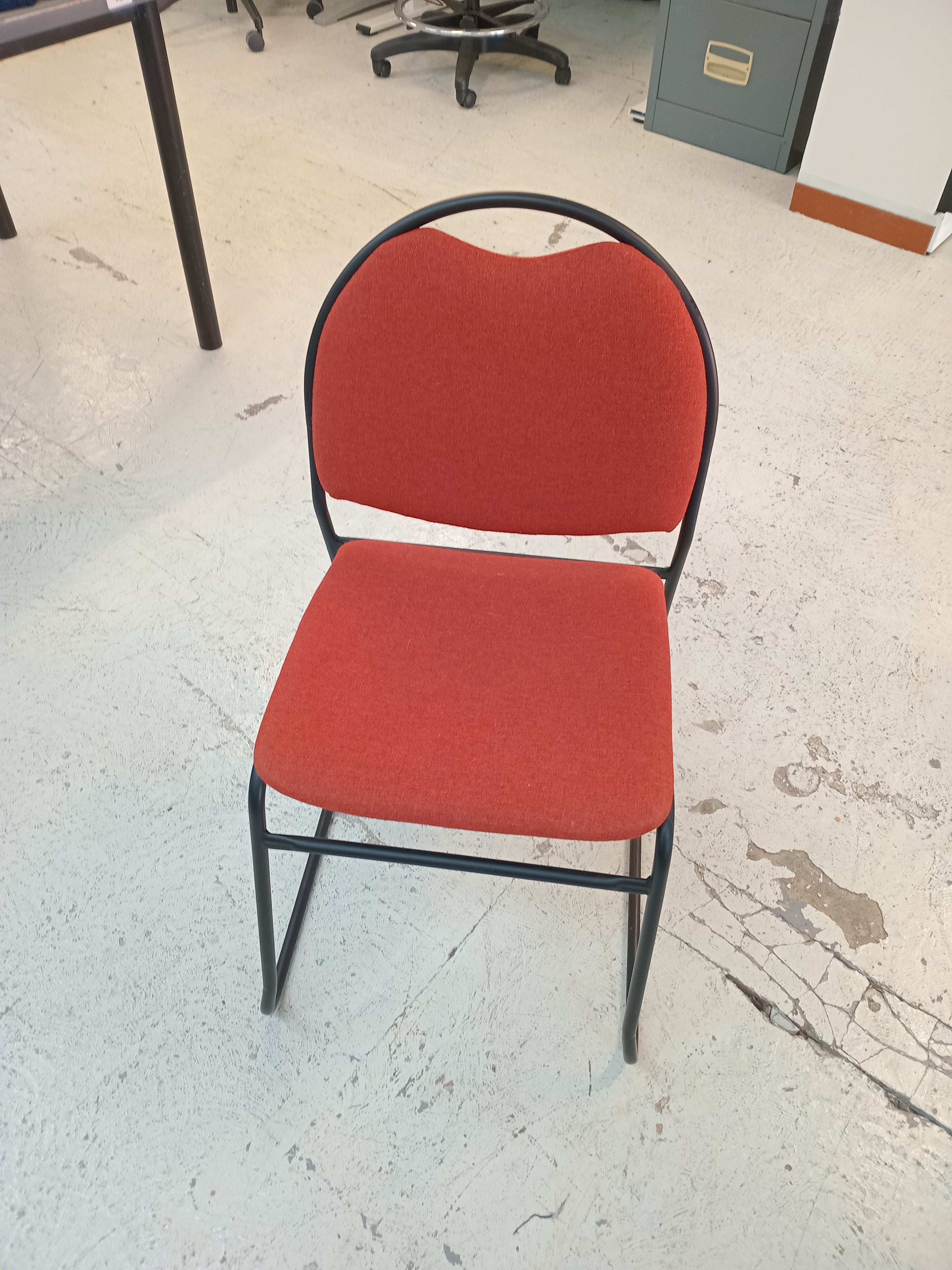 Red rounded back fabric chair