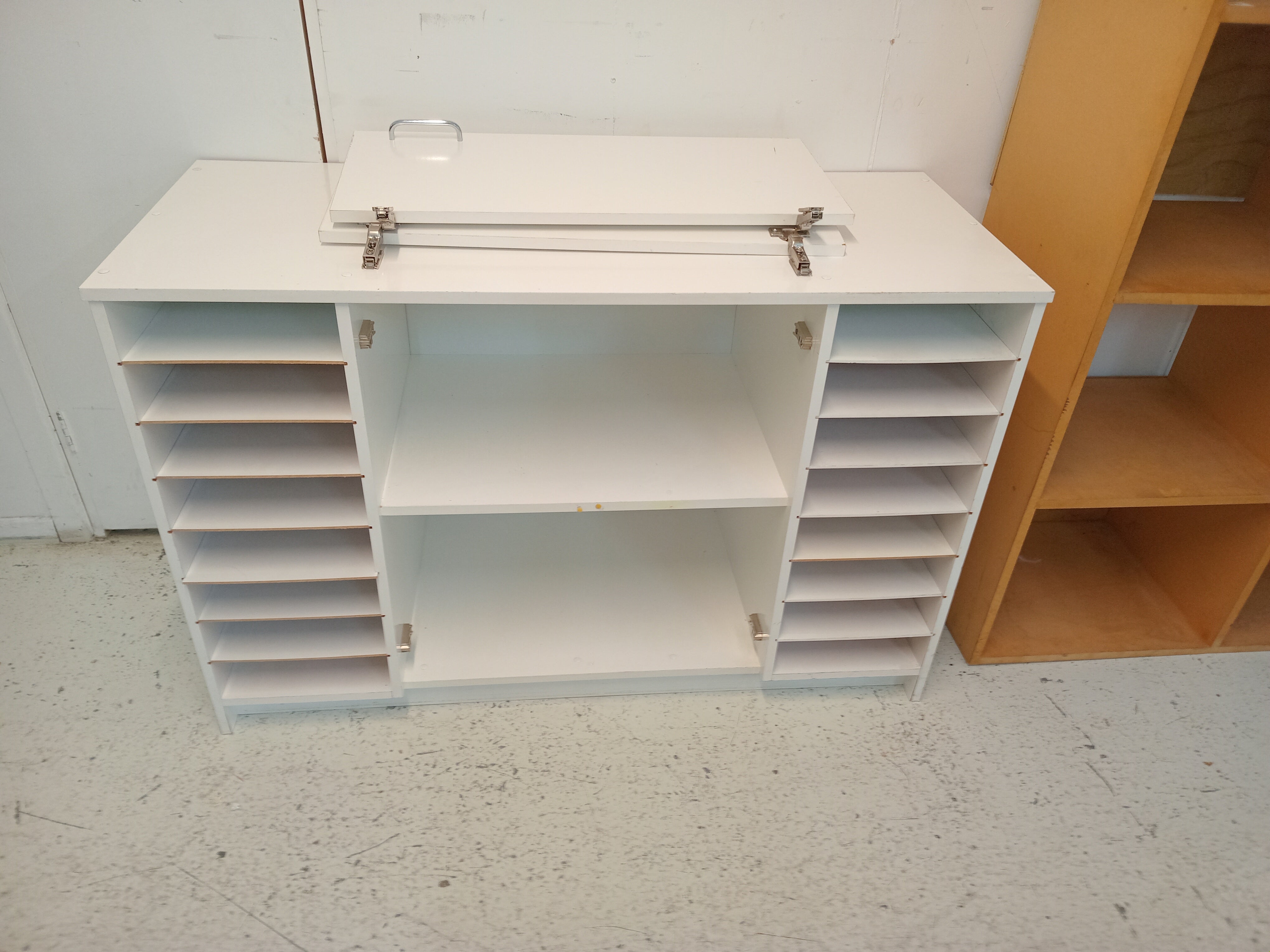 White cabinet with side trays